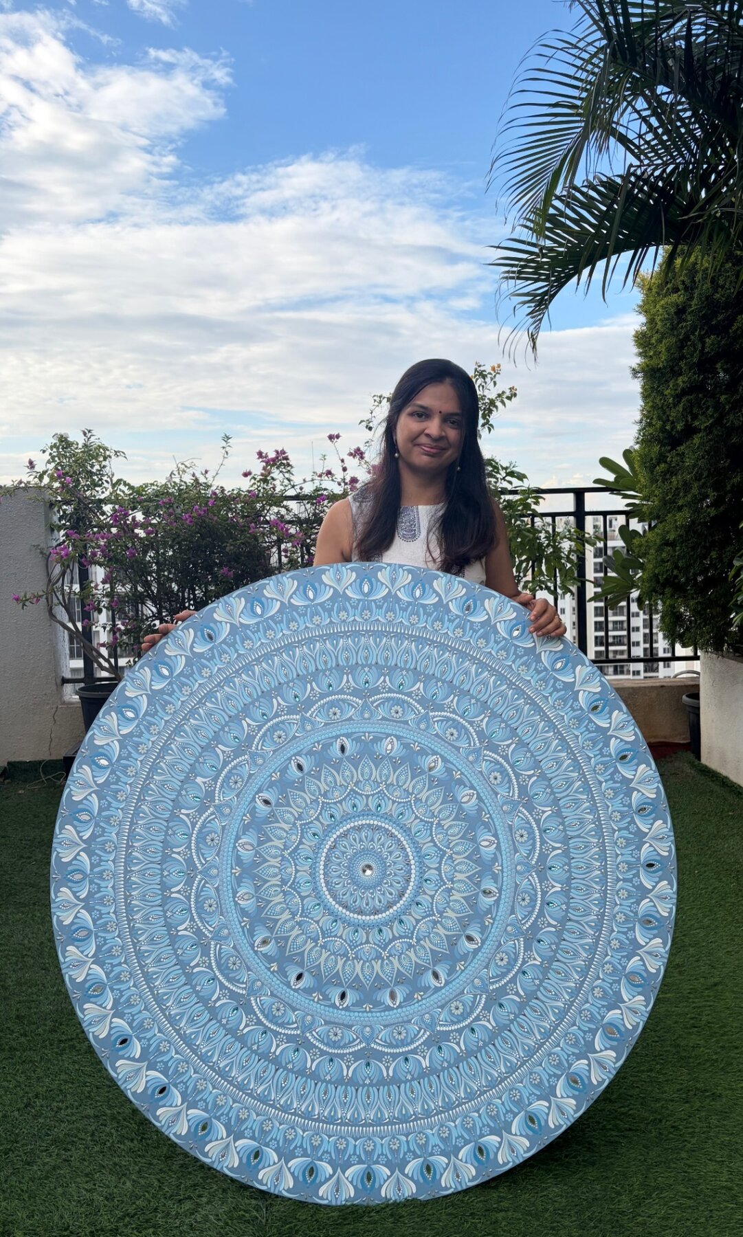 Large blue mandala held for scale